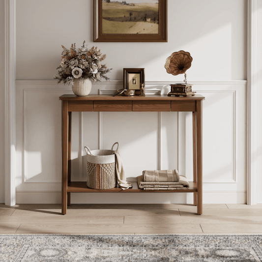 Console table styled beneath a wall mirror in an entryway