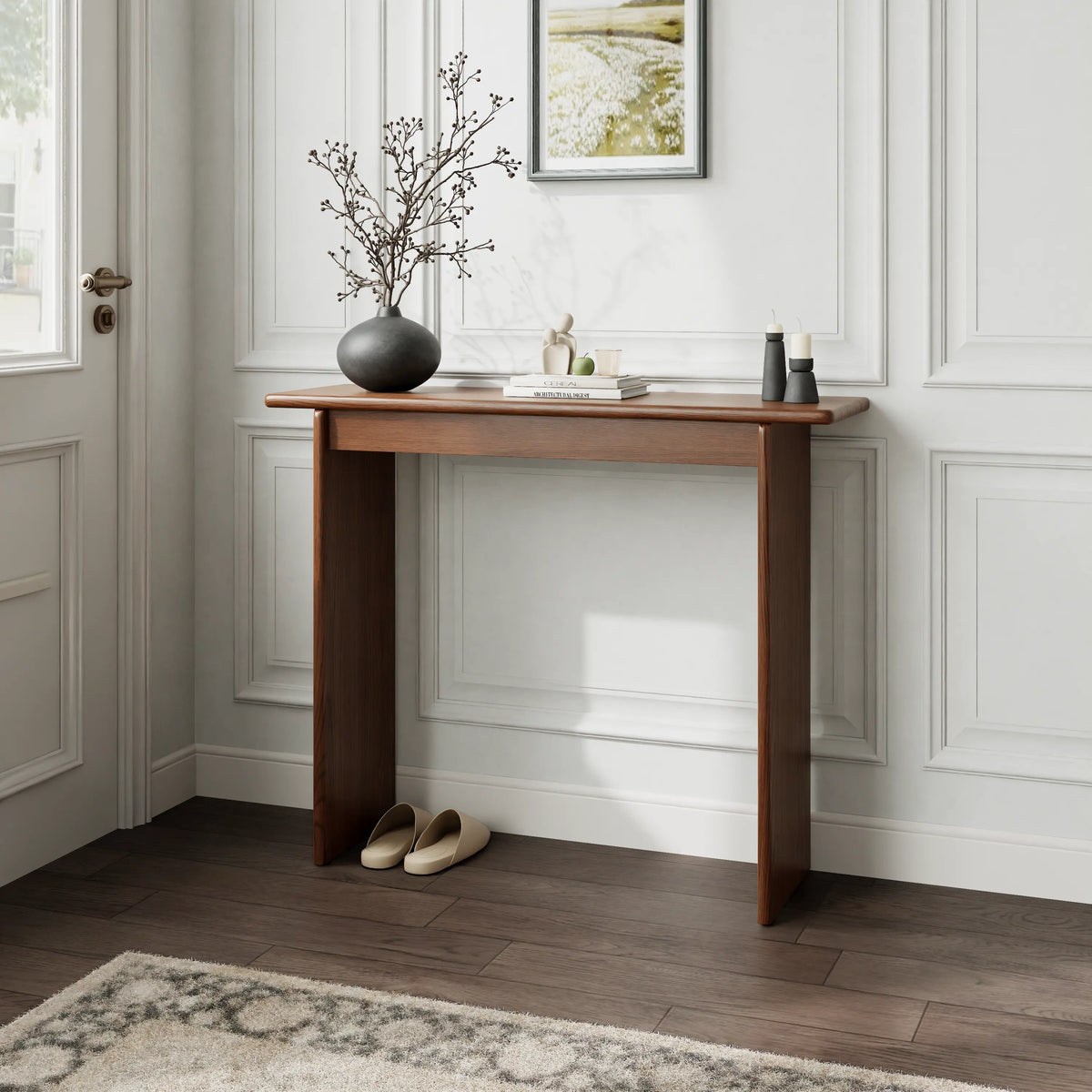 Walnut console table styled against a paneled wall