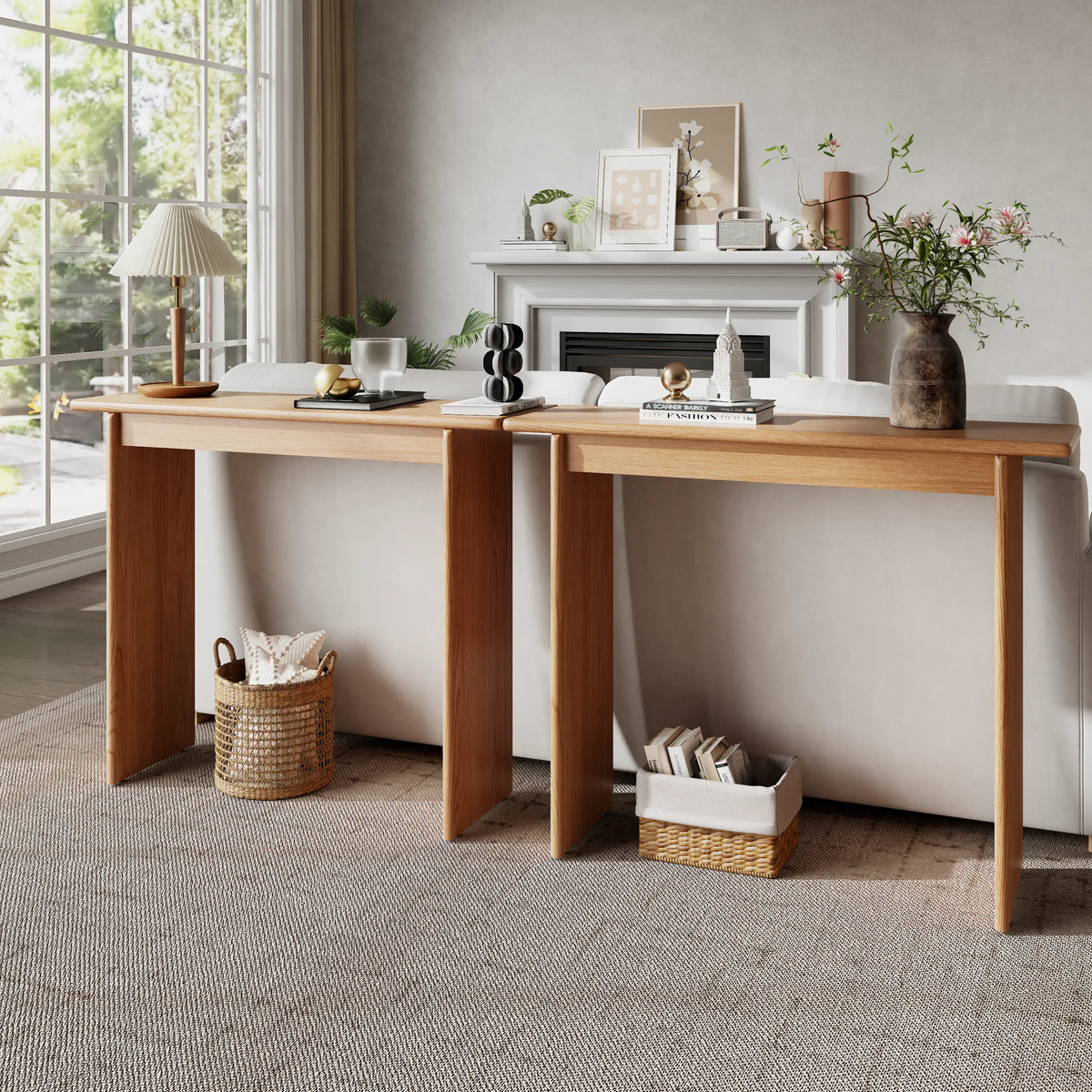 Two natural console tables placed behind a sofa