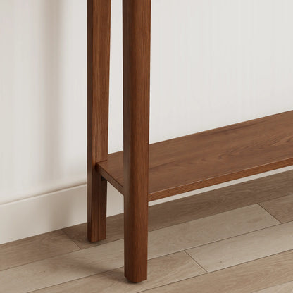 Close-up of the console table lower shelf and tapered legs