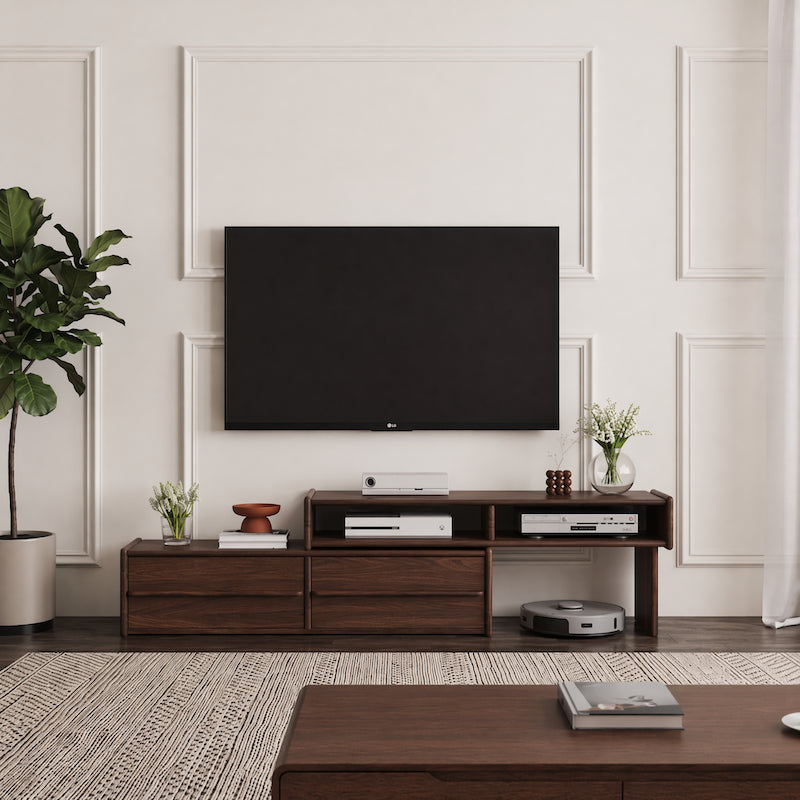 Modern living room with a television mounted on the wall above a wooden entertainment console.