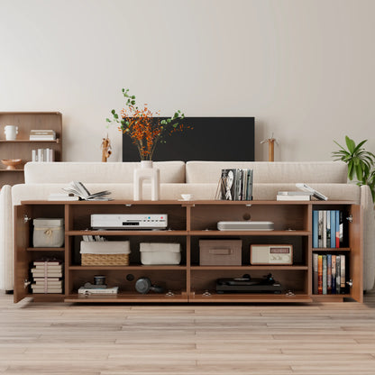 Low-profile walnut media console styled in a living room