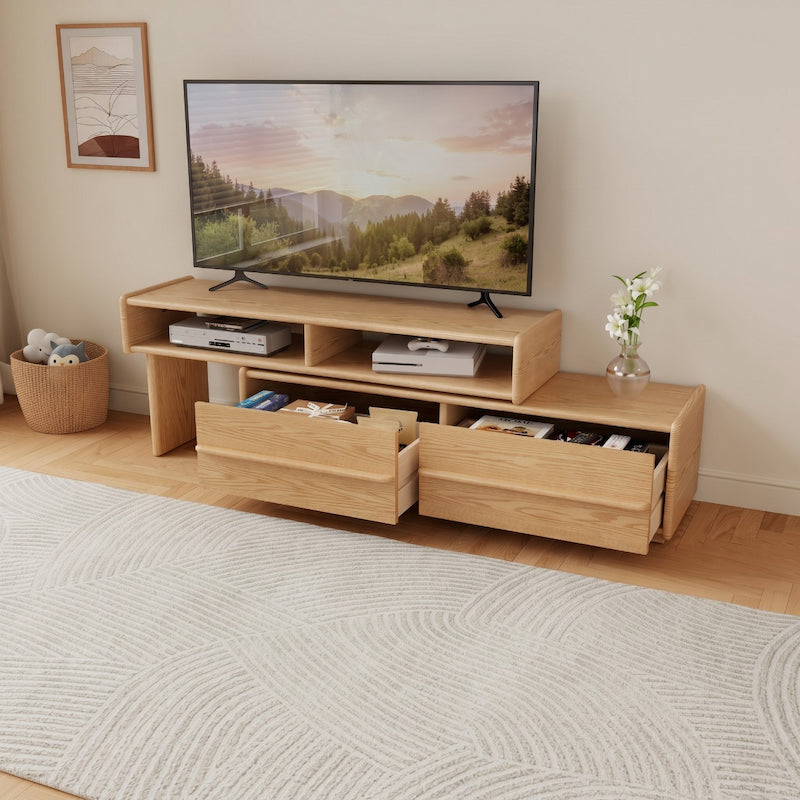 Wooden TV stand with a television displaying a nature scene, placed in a room with a rug and decorative items.