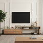 Modern living room with a flat-screen TV mounted on the wall, wooden entertainment console, and decor items.